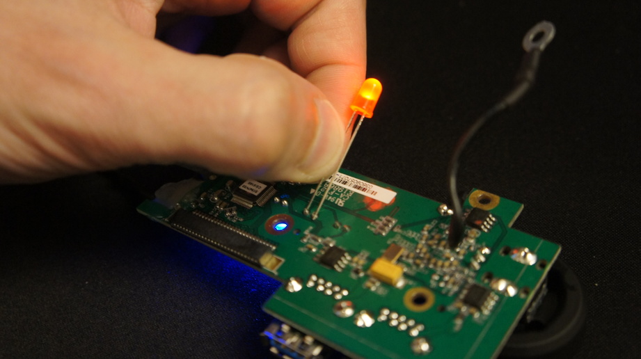 Applying an LED to the circuit board and watching it light up